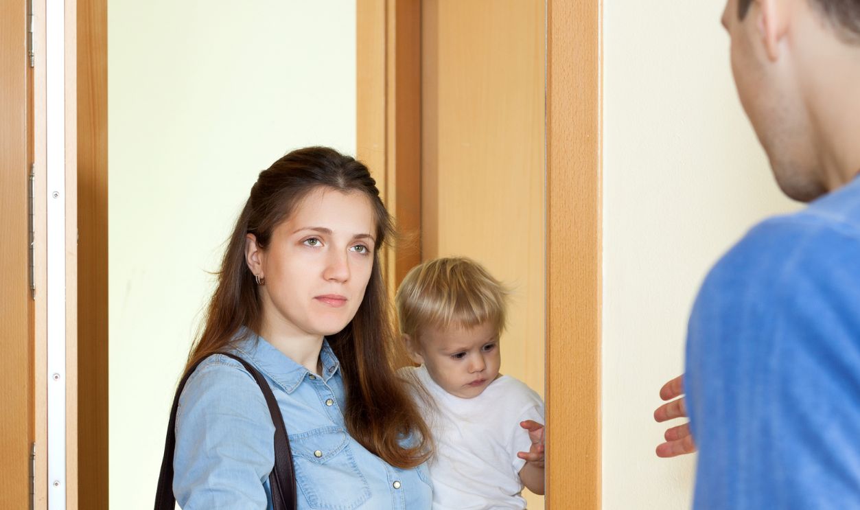 Family quarrel. Woman with baby girl leaving from her husband