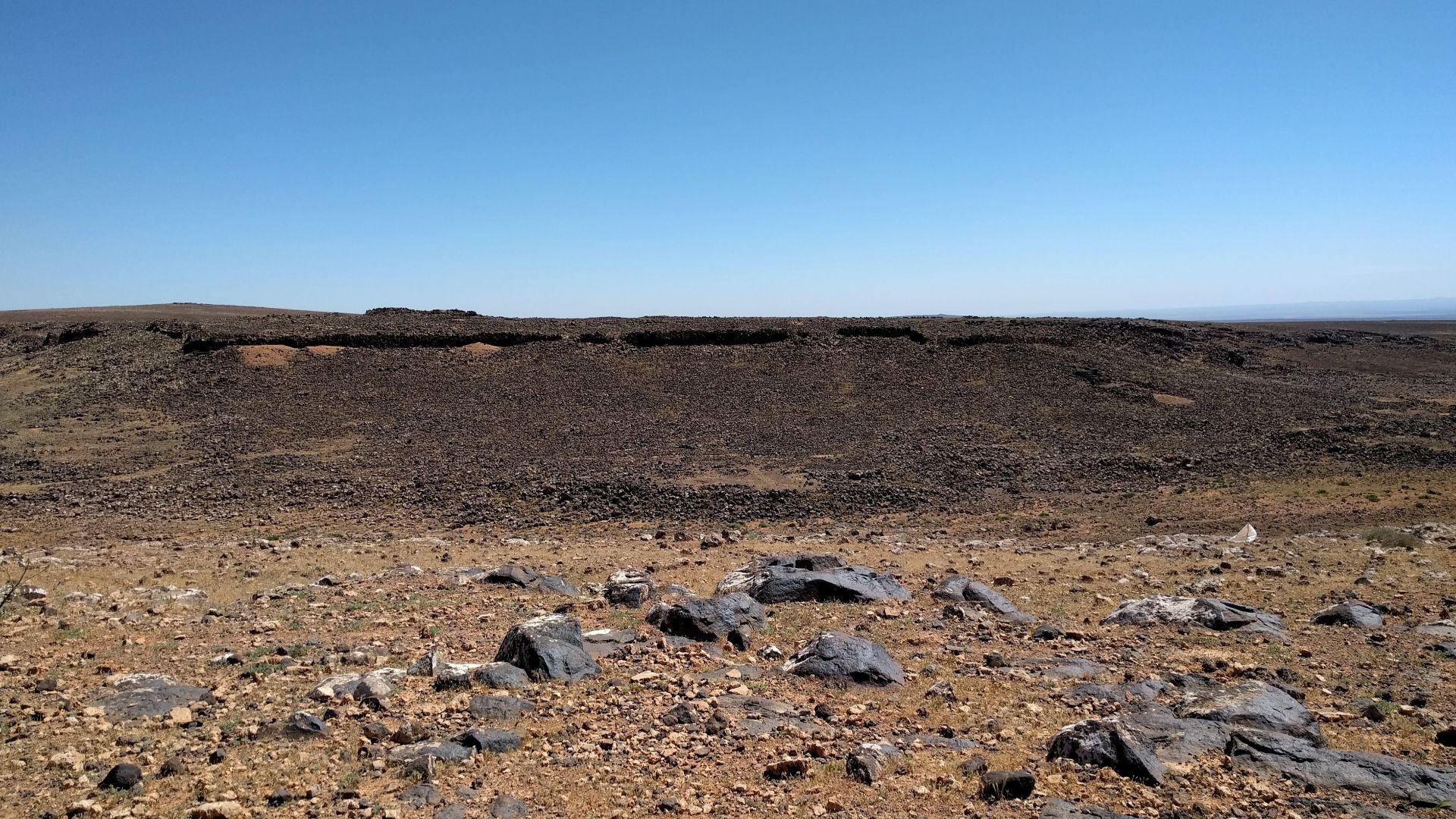Photograph of the ruins of Jawa, a Bronze Age city in the Black Desert, eastern Jordan.