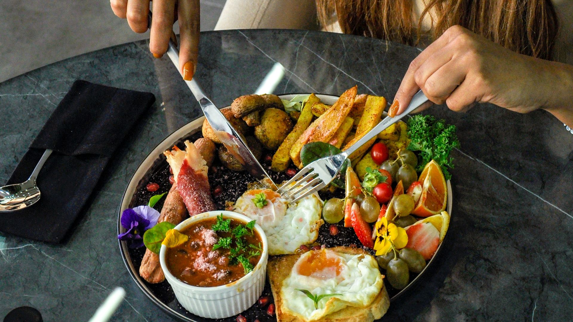 a person holding a plate of food