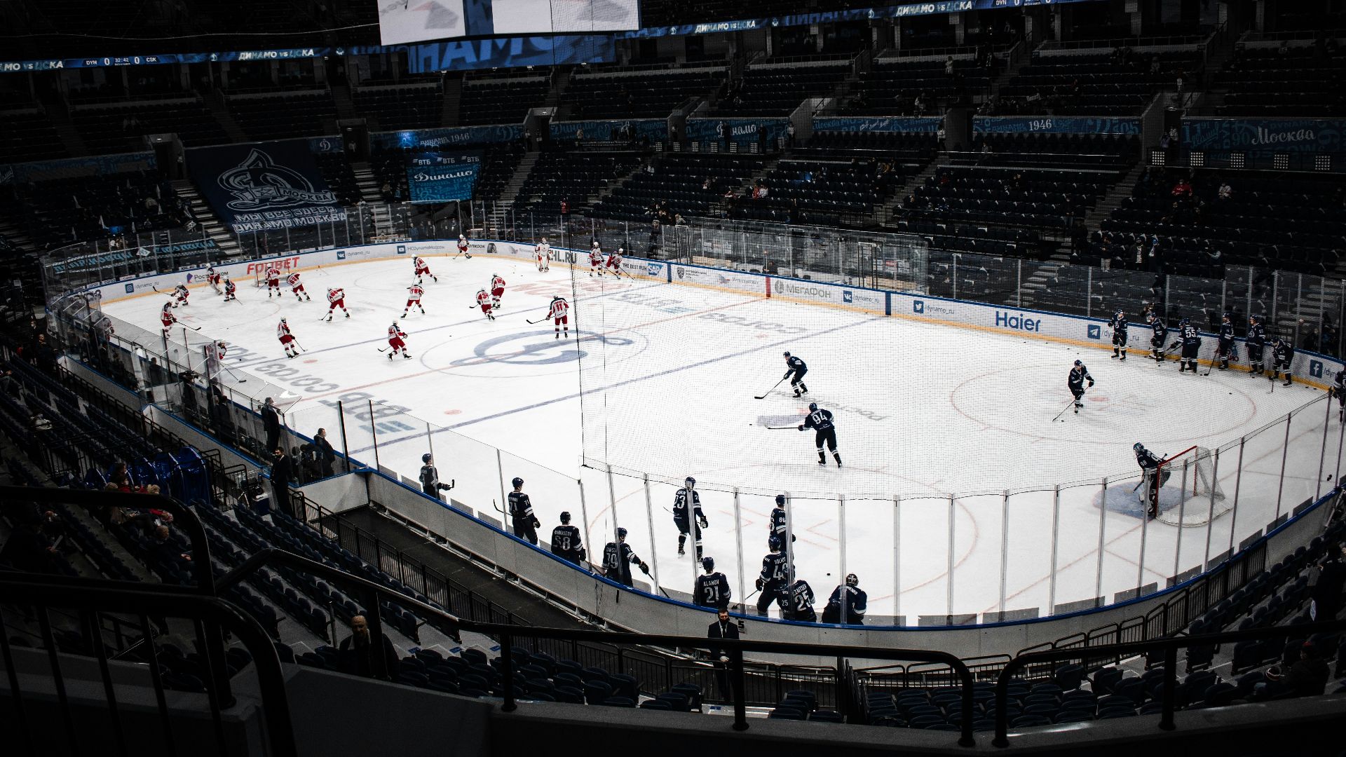 people playing ice hockey on ice stadium