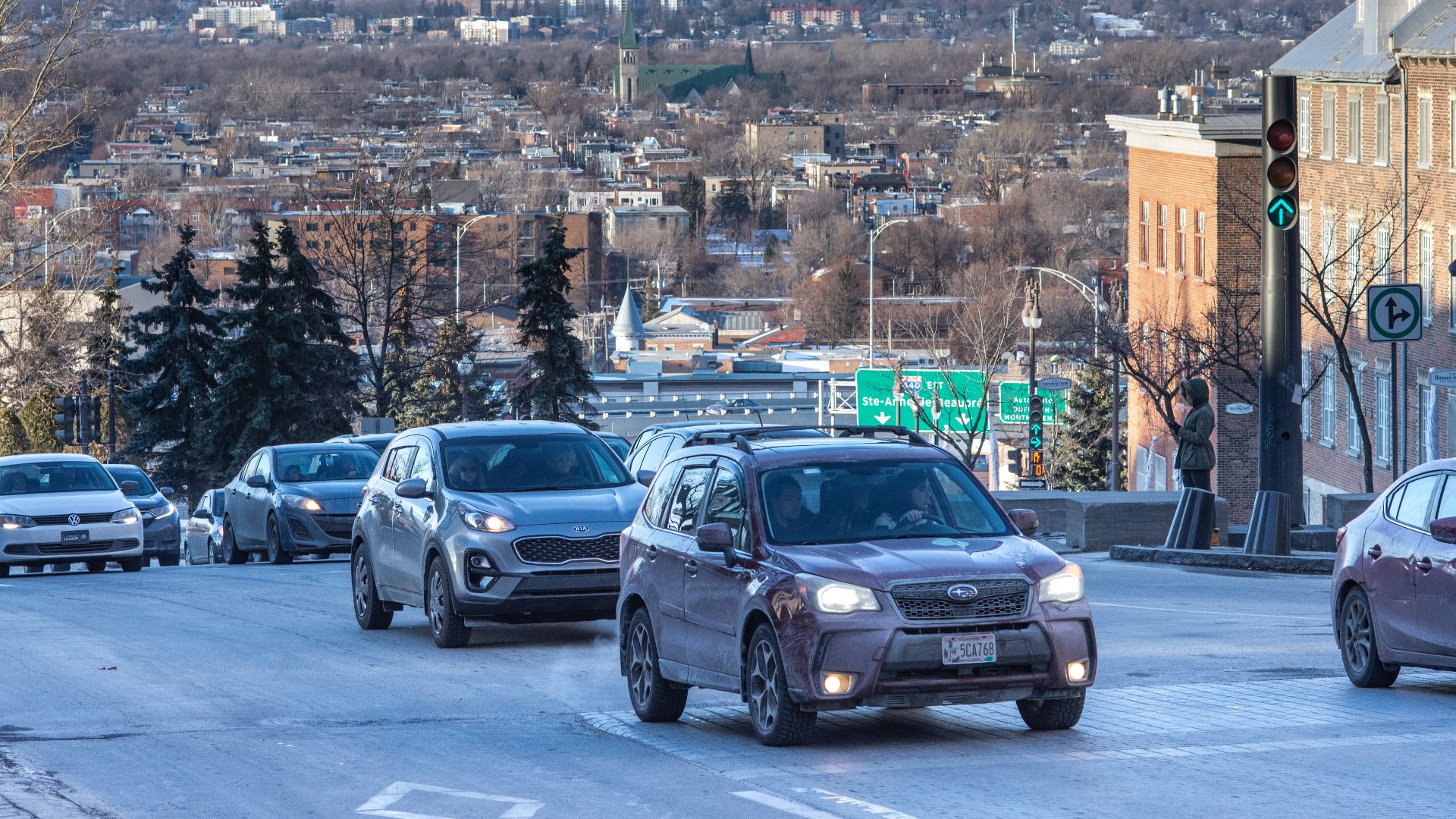 Traffic on Avenue Honoré-Mercier with the roofs of the lower town and the hills beyond. Quebec City, Quebec, Canada.