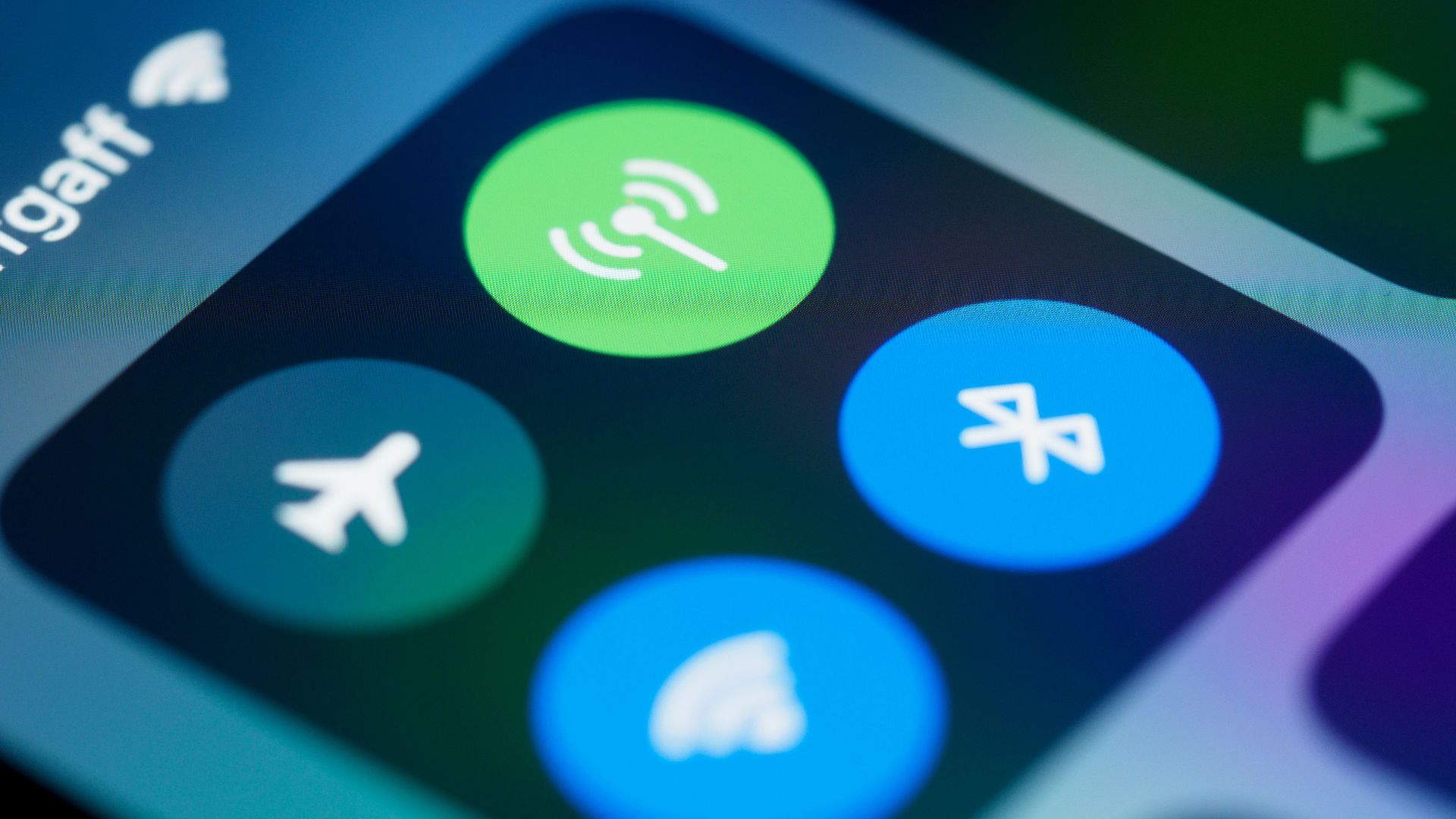 Detailed close-up image of a smartphone's control center showing various connectivity icons.