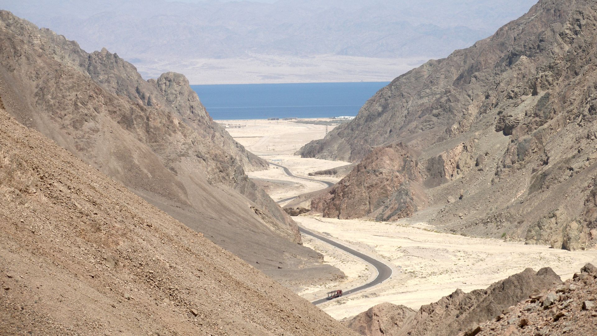 Sinai Desert, Egypt. Gulf of Aqaba and Saudi Arabia coast clearly seen ahead. Sinai, a region of stark beauty. The South Sinai beckons with epic mountain landscapes that are everything barren.