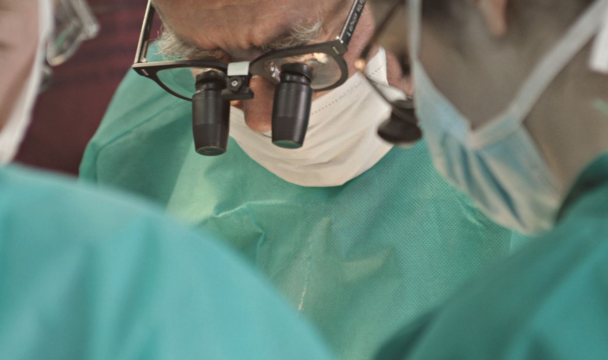 Focused surgical team in an operating room performing a procedure
