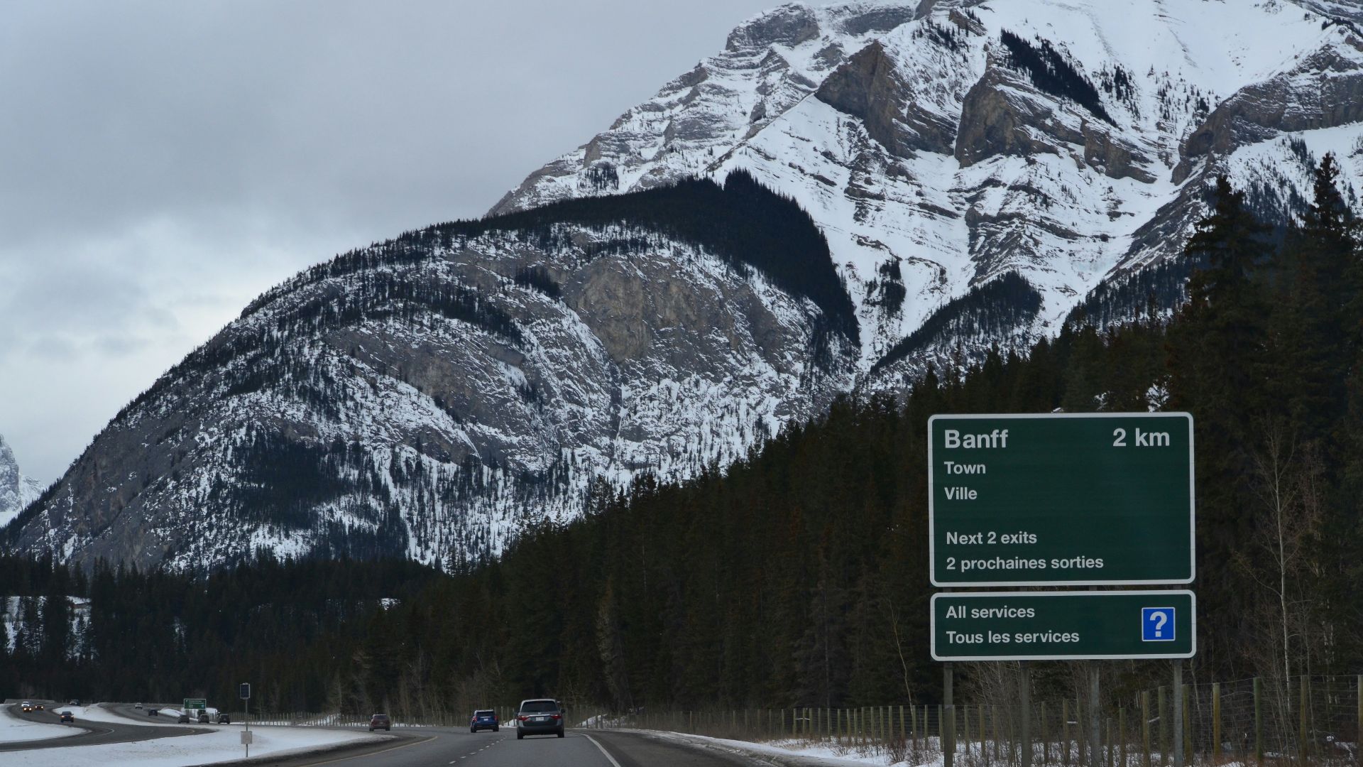 a highway with a mountain in the background