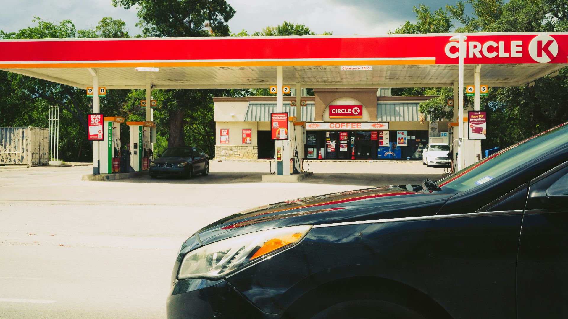 Circle k gas station with cars and trees
