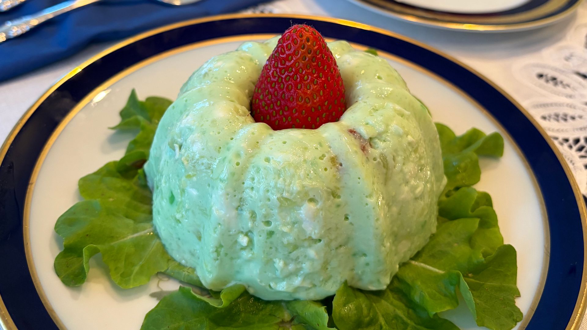 Lime jello, mayonnaise, cottage cheese, chopped candied pecans, and sugar