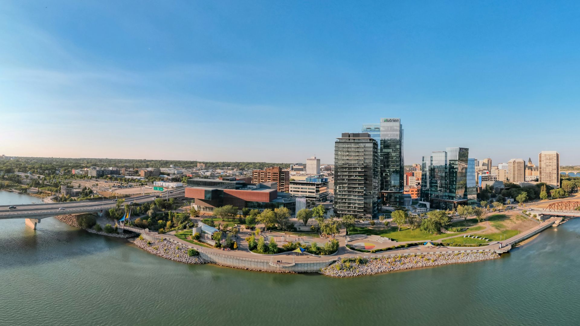 a body of water with a city in the background