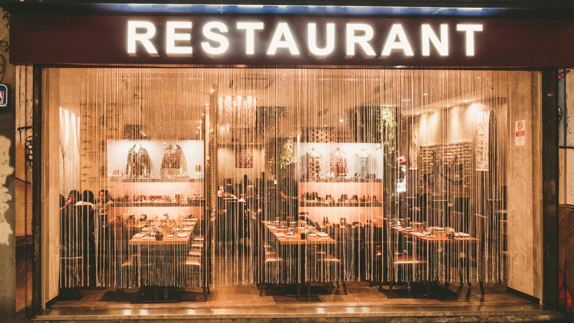 a restaurant that is lit up at night