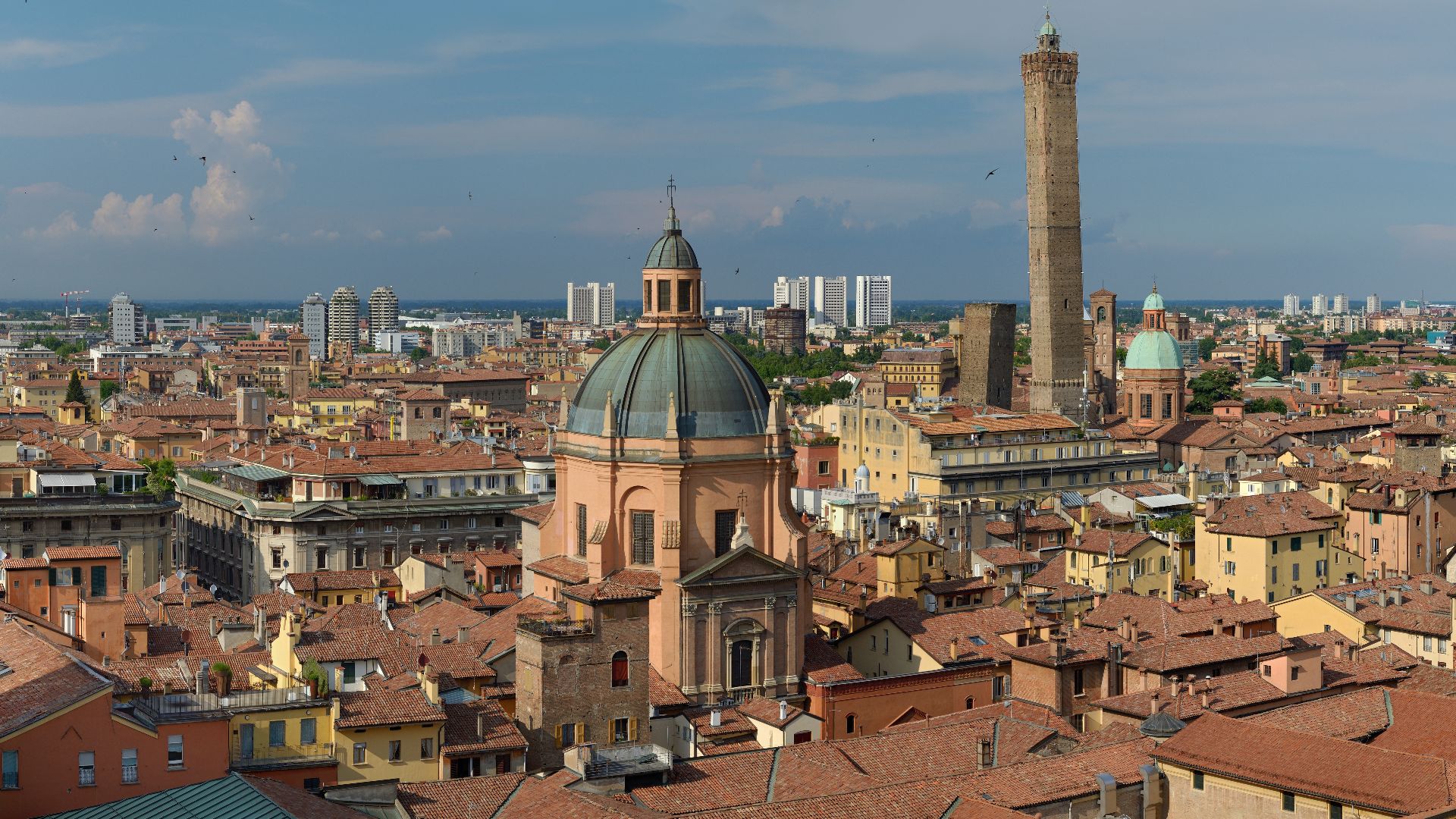 View from the top of the Basilica di San Petronio in 2016. In the foreground - Sanctuary of Santa Maria della Vita, to the right two inclined towers - Garisenda and degli Asinelli, more to the right - Chiesa dei Santi Bartolomeo e Gaetano.