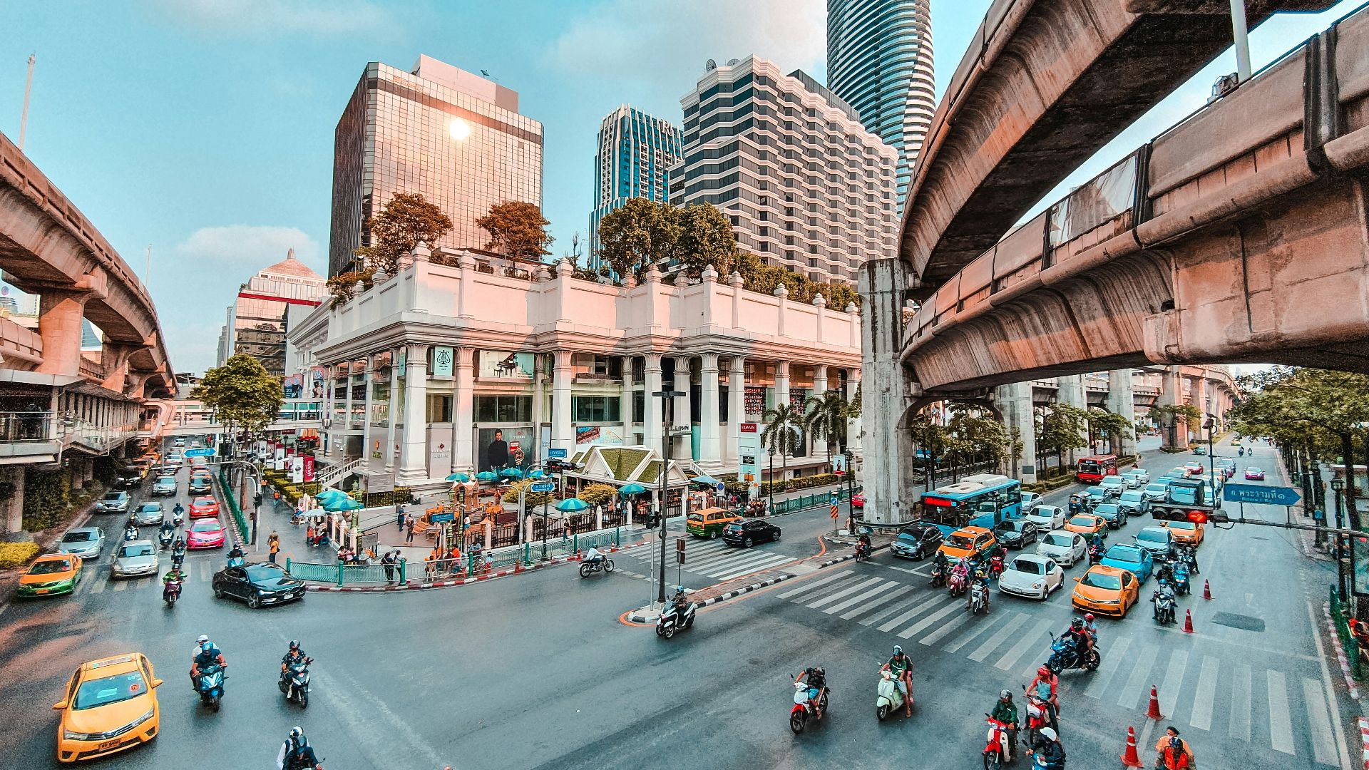 cars parked on side of the road near buildings during daytime