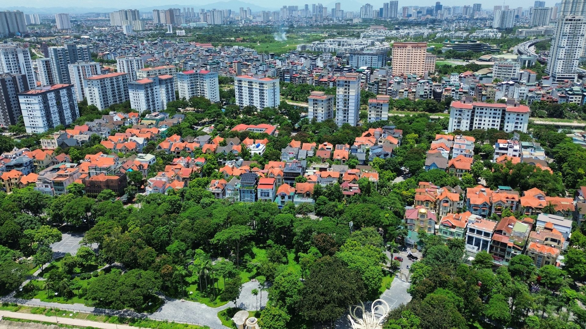 Aerial view of a dense urban neighborhood with trees