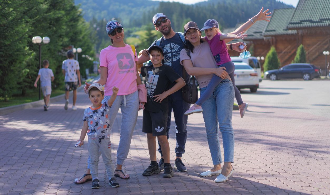 A joyful family of six spending quality time together in a scenic outdoor setting