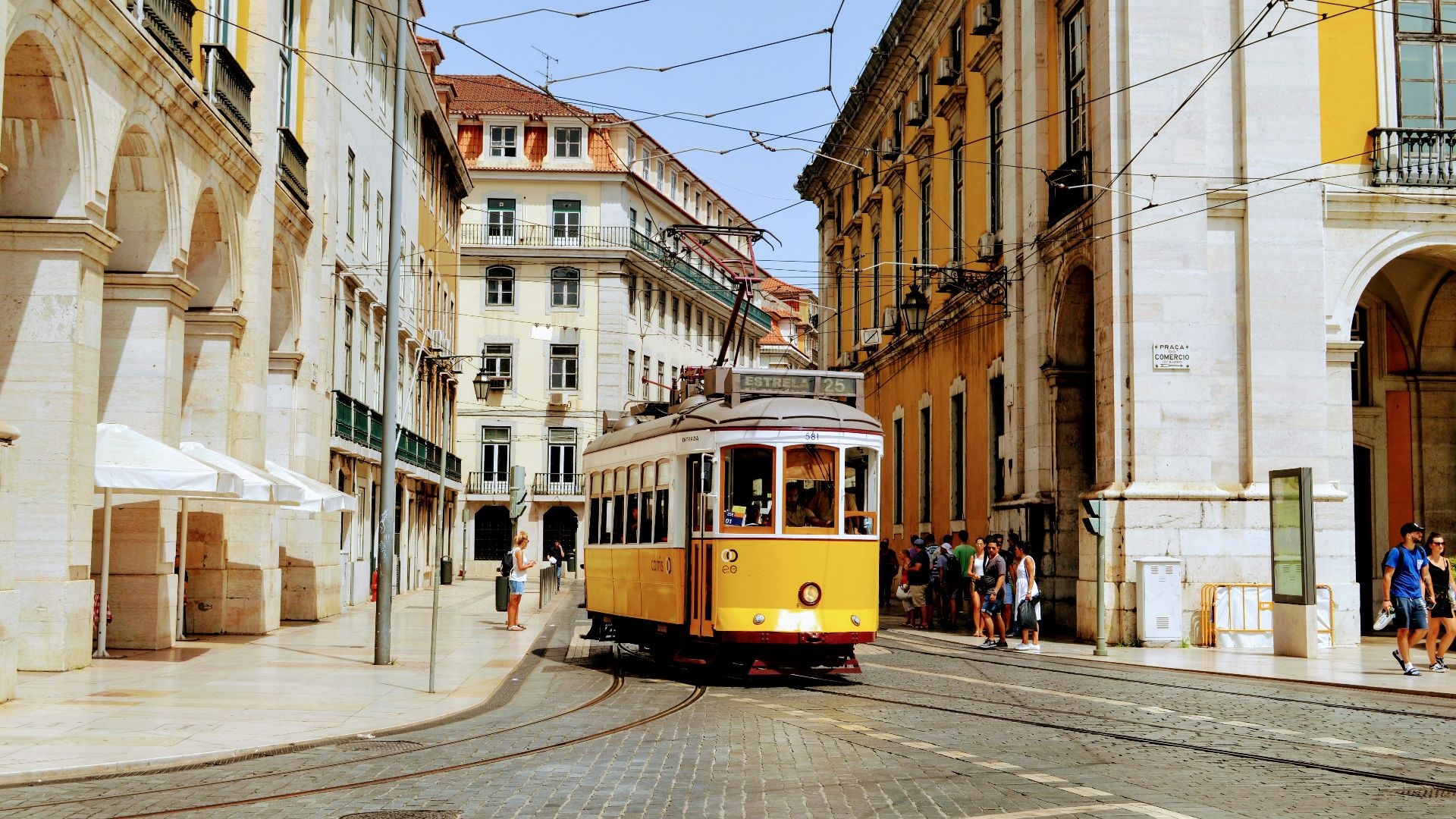 yellow and white tram on road during daytime