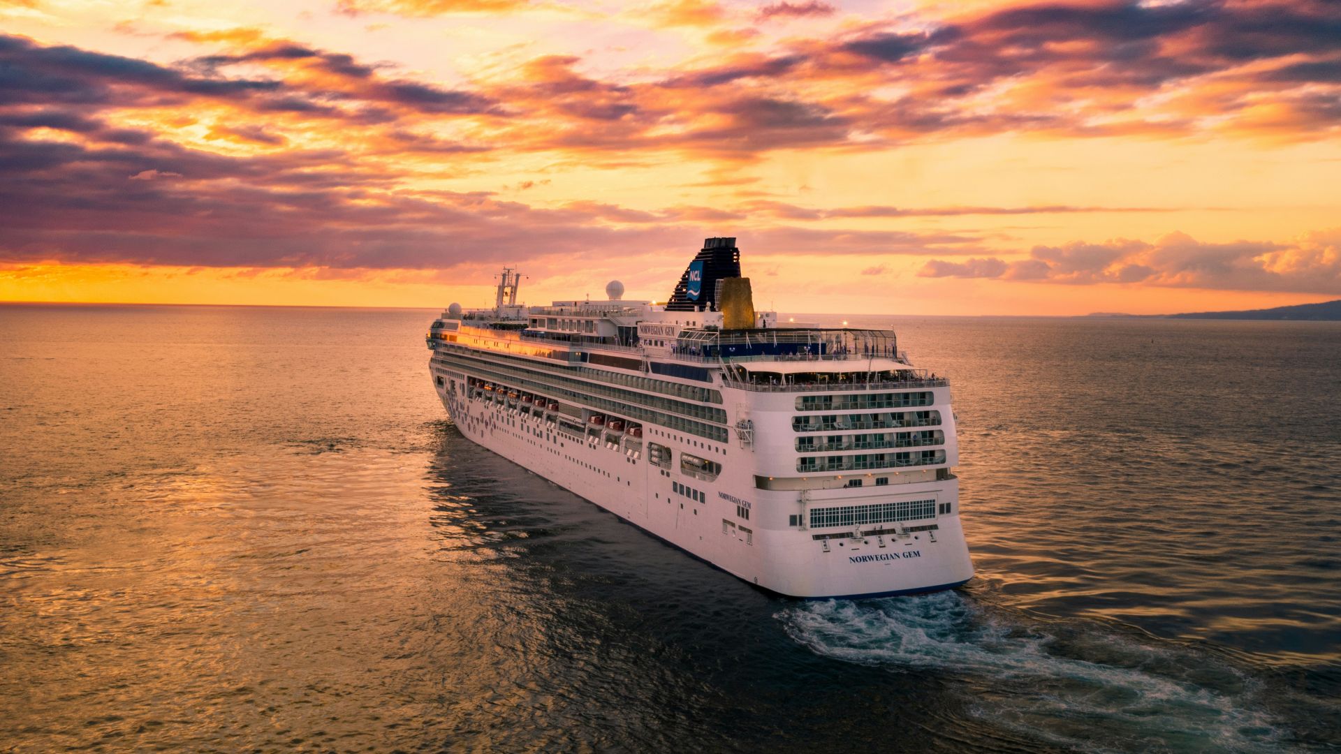 white cruise ship under cloudy sky