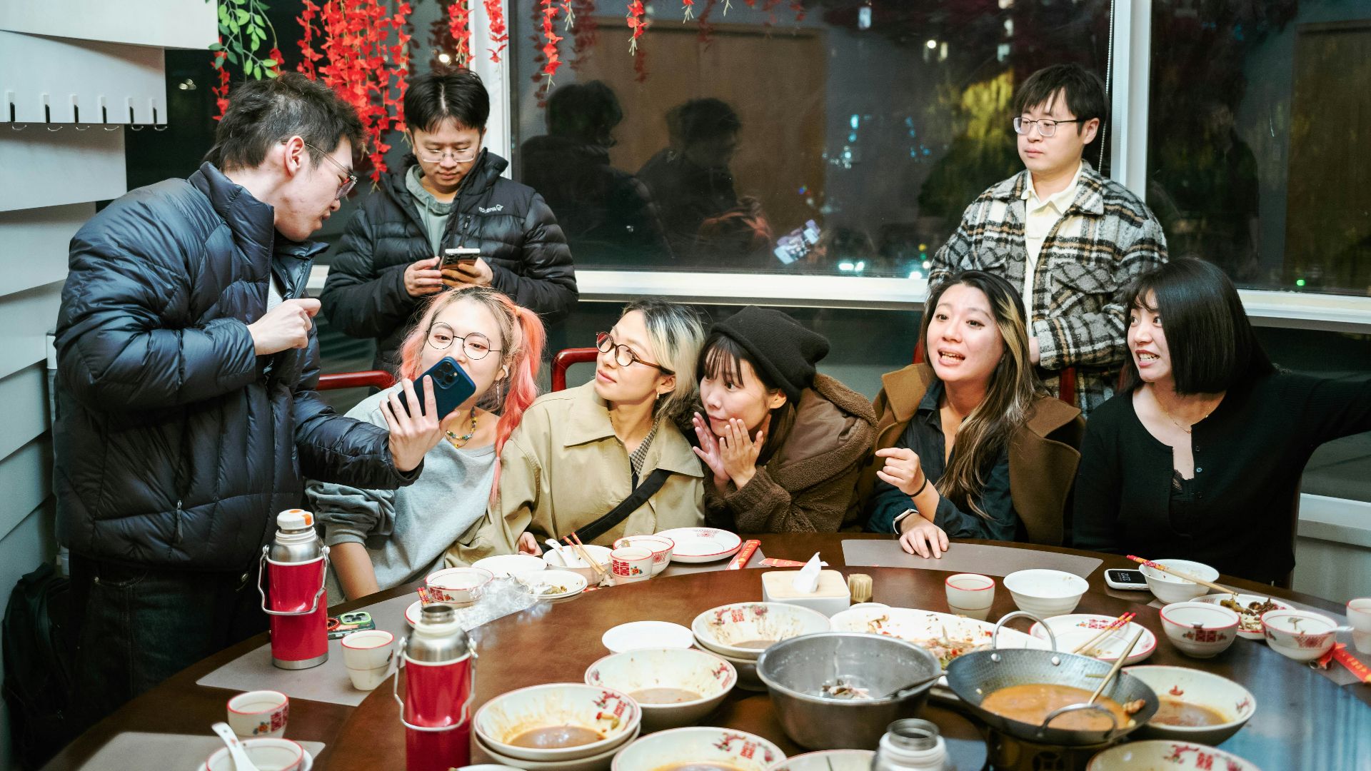 Group of friends gathered around a table for a meal.