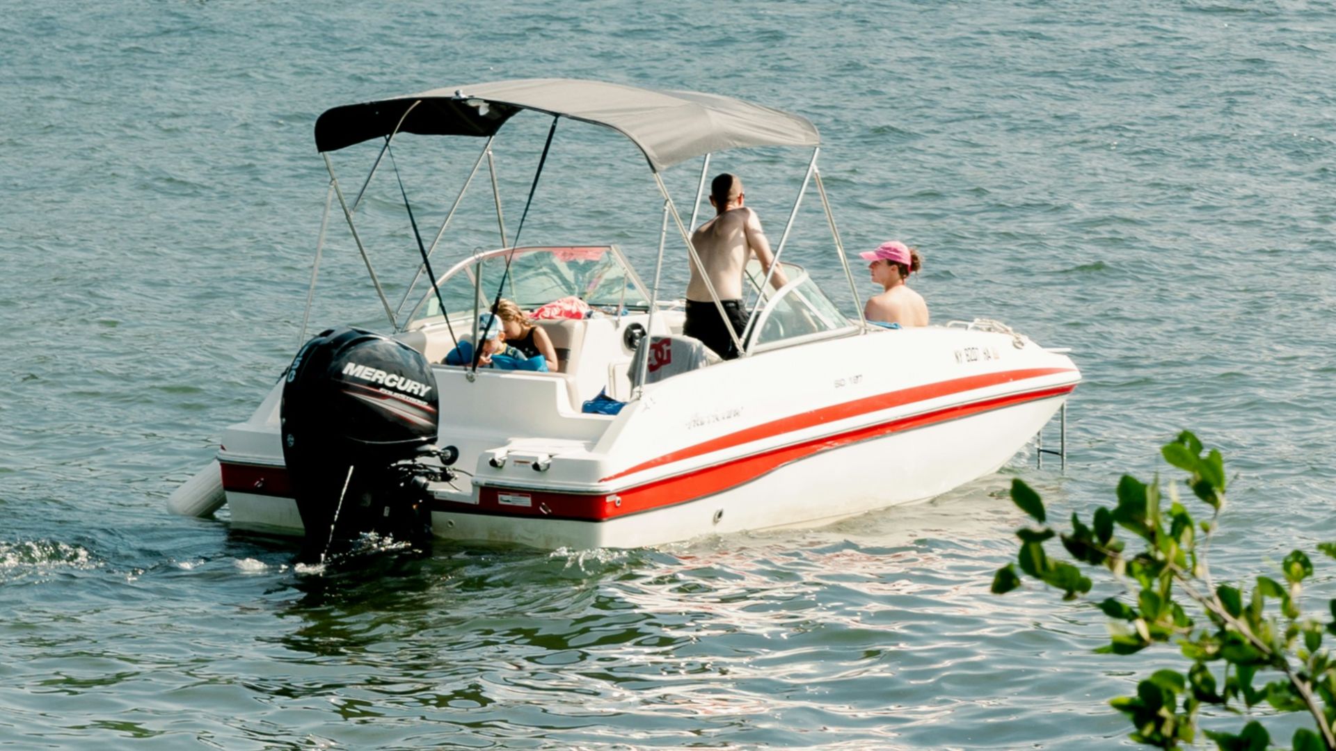a group of people on a boat in the water