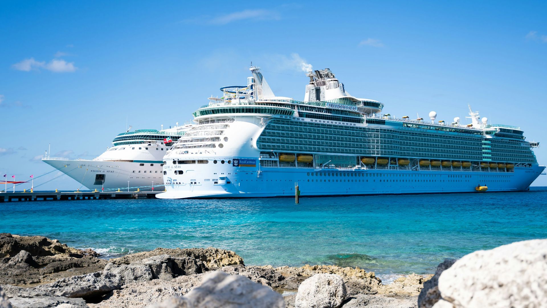 a cruise ship docked at a dock in the ocean
