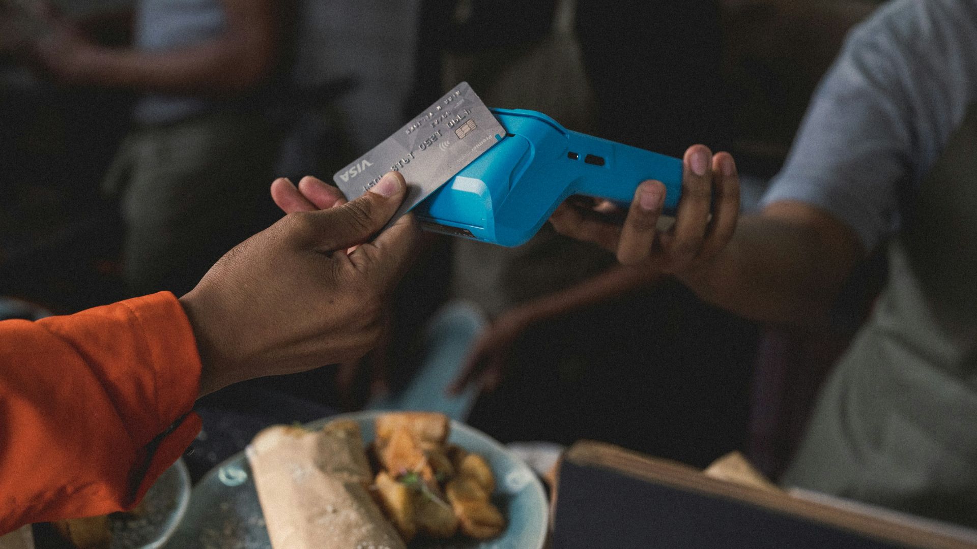 a person holding a blue object in their hand