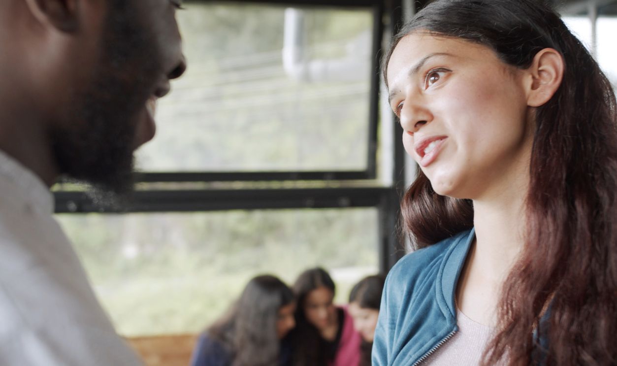 Indian female talking with her friends with a serious face