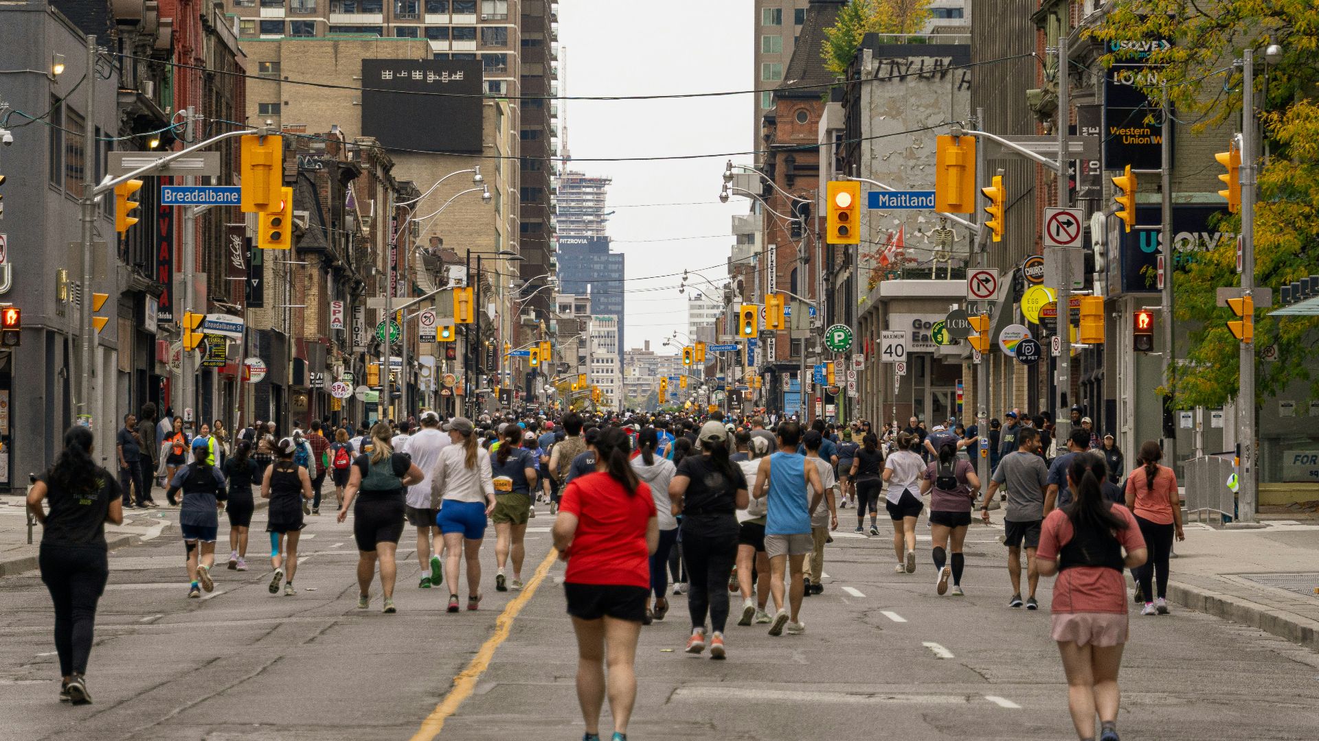 Crowd of runners participating in a city marathon race