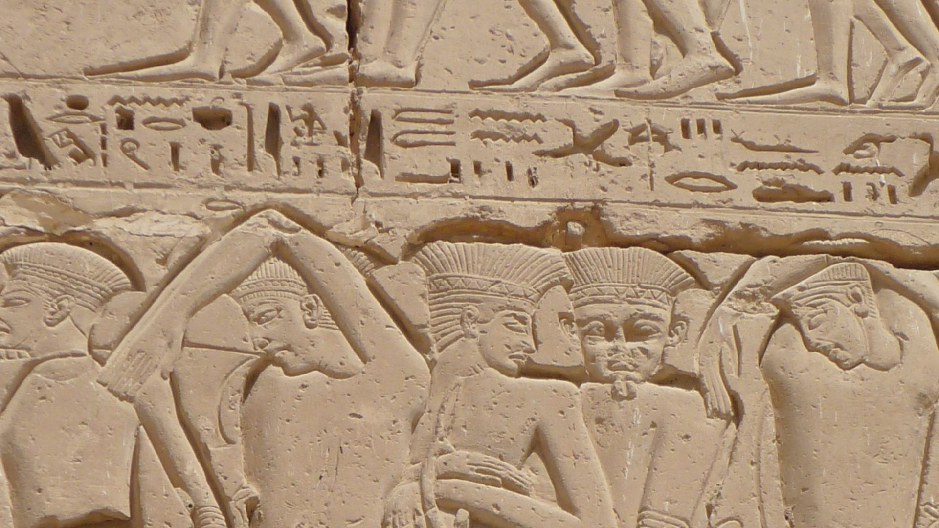 Wall relief of Philistine captives being led away after their failed invasion of Egypt, mortuary temple of Ramses III, Medinet Habu, Theban Necropolis, Egypt