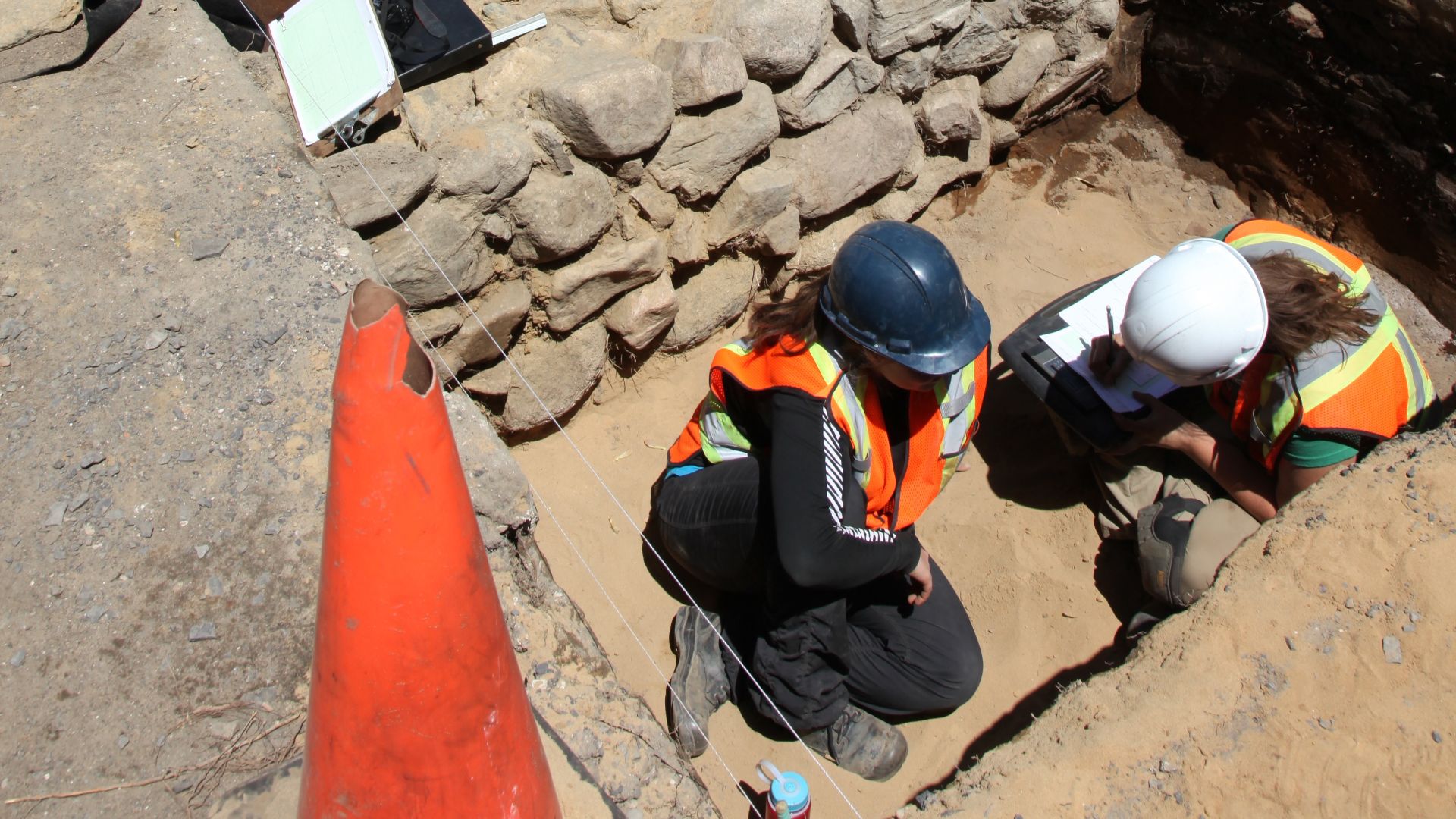 A half-excavated foundation wall, made out of field stones in 18th century during an archaeological excavation in Ancienne Lorette near Quebec City, Canada.