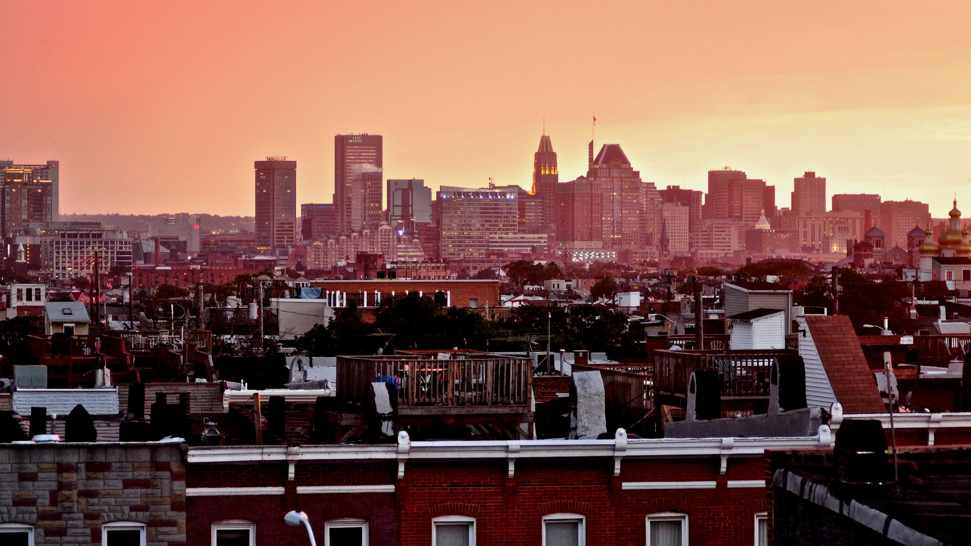 a view of a city skyline at sunset