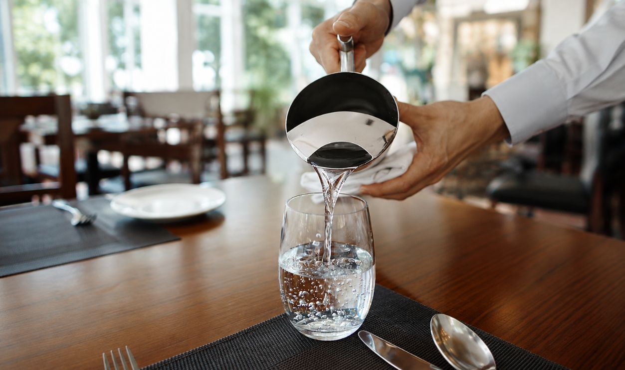 refilling glass with water
