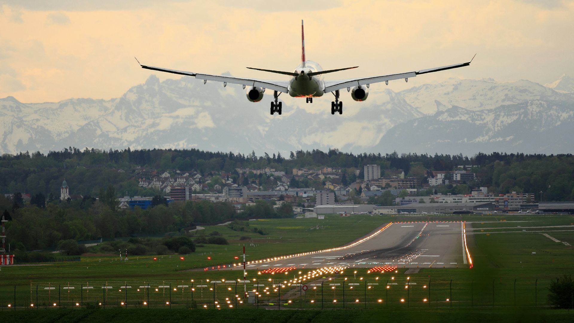 commercial airplane landing on runway