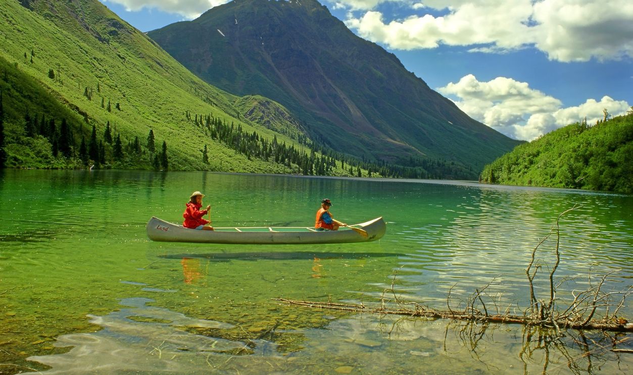 KLUANE NP, CANADA – JULY 5, 1997: Canoe on the St. Elias Lake of Kluane National Park