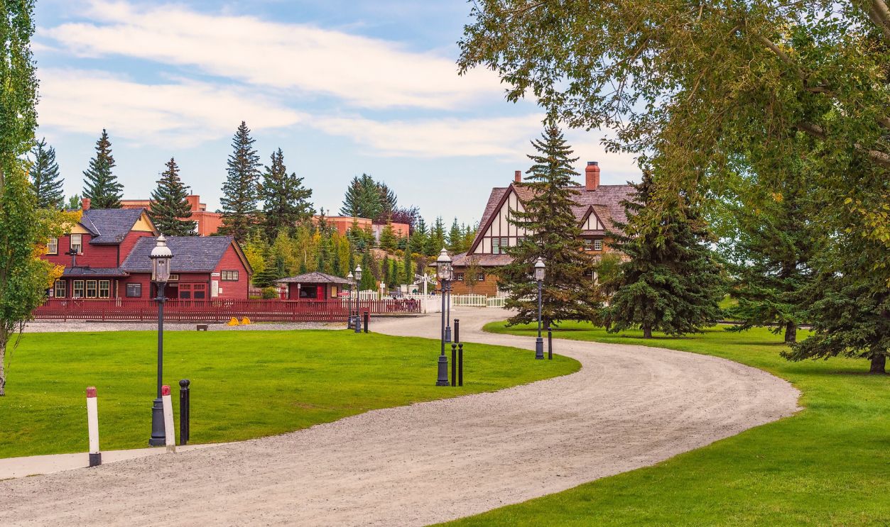 Calgary. Alberta. Canada - August 29, 2016 - Heritage Park Historical Village. An access road to the village with a railway crossing