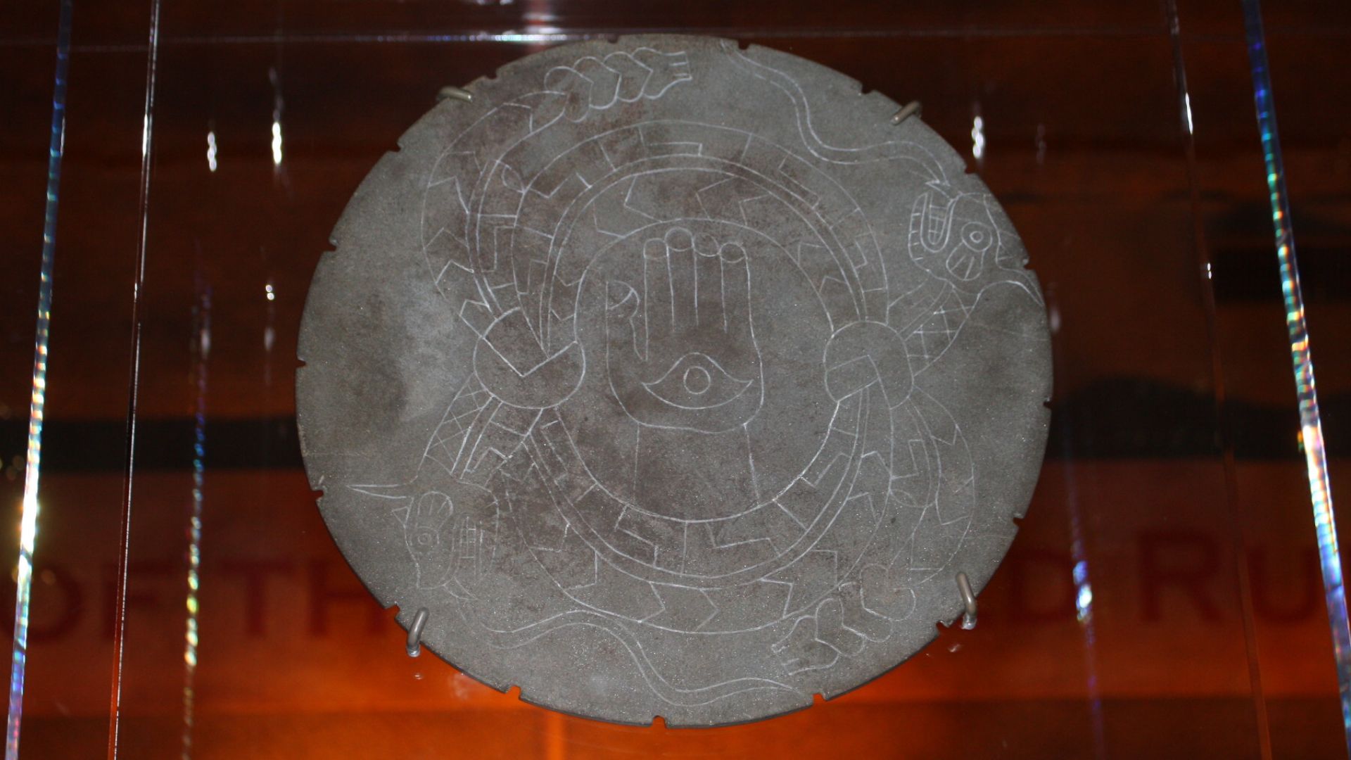 The Rattlesnake Disk.  A ceremonial stone palette plowed up by a 19th century farmer in Moundville, Hale County, Alabama, United States.  Housed in the Jones Archaeological Museum at the Moundville Archaeological Park.