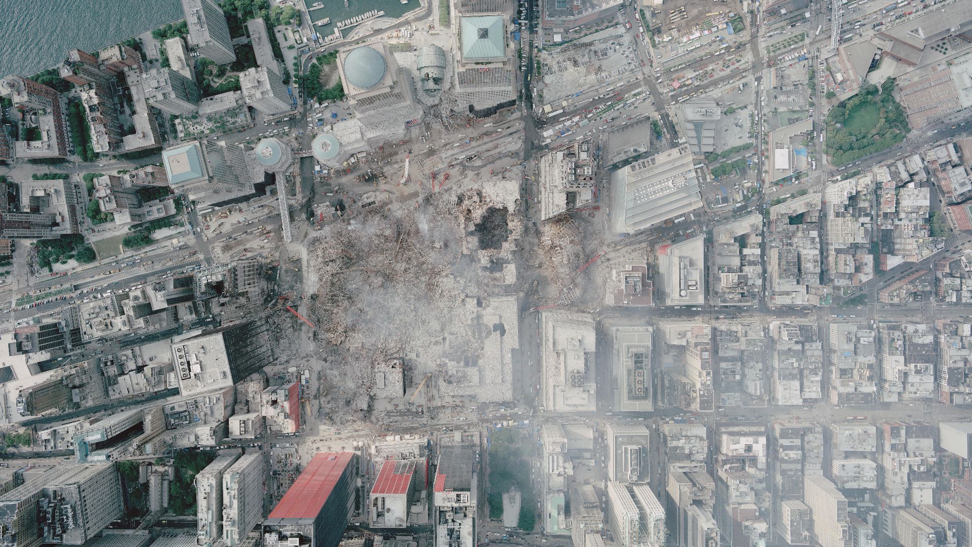 Remains of the World Trade Center complex in downtown New York City, United States, after the September 11 attacks. Image taken by NOAA's Cessna CitationJet on September 23, 2001, from an altitude of 3,300 ft (1,005 m) using a Leica/LH systems RC30 camera