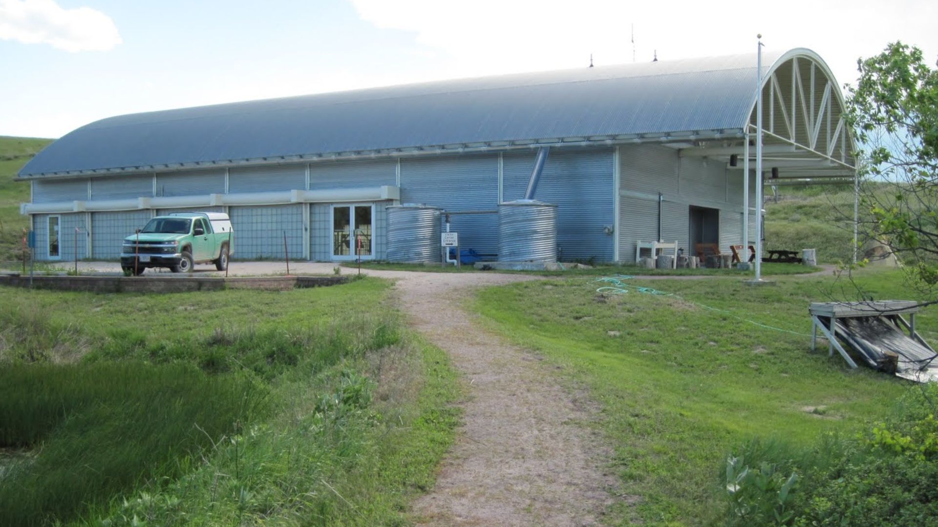 Climate controlled building which covers the central portion of the bonebed with outside screening table visible on the right.  -  Hudson-Meng Bison Bonebed, northwest Nebraska in the Oglala National Grasslands. - 06.16.10