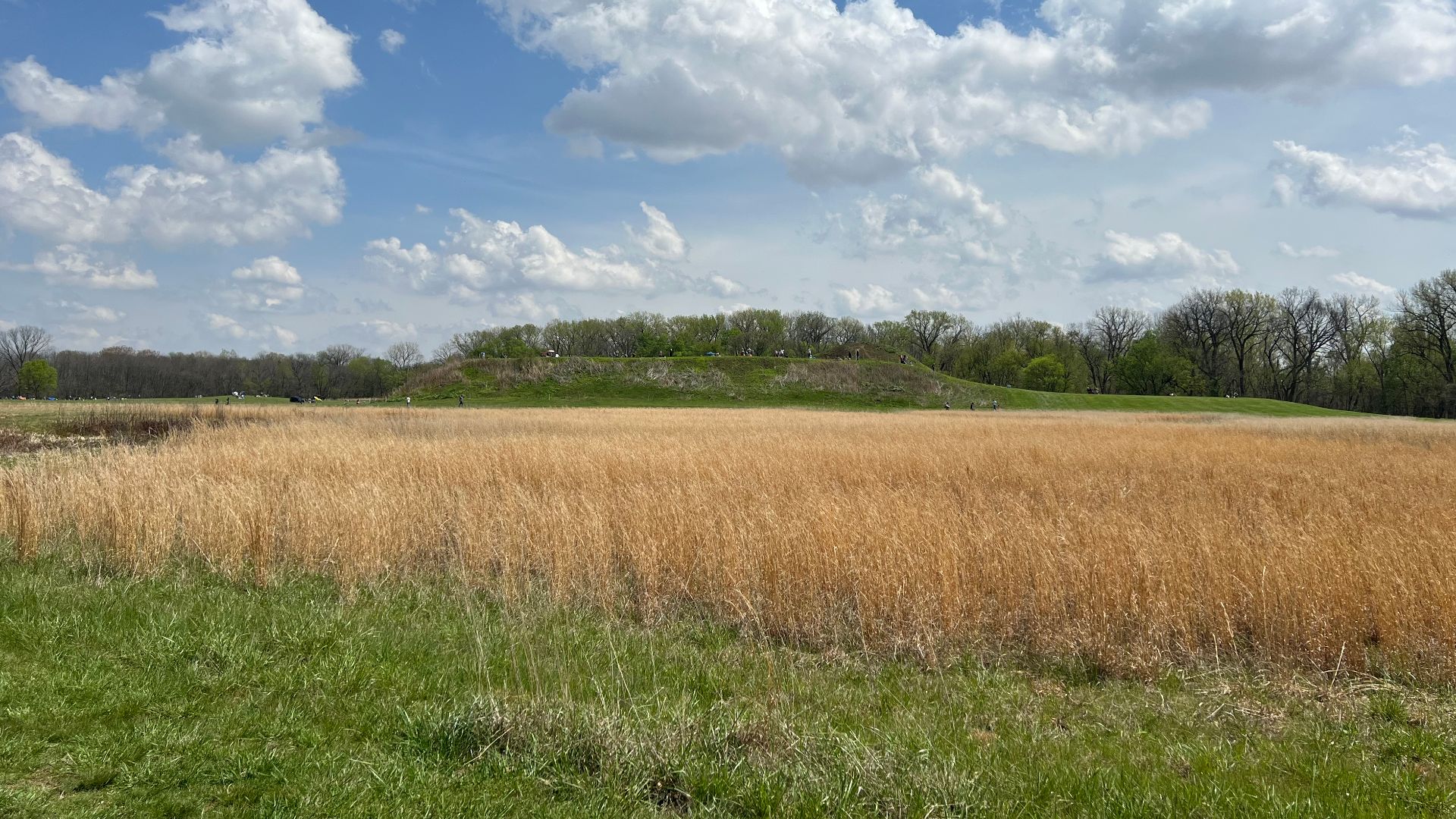 Mound A from Mound C at the Angel Mounds State Historic Site. Note the people gathered to watch the total solar eclipse of April 8, 2024.