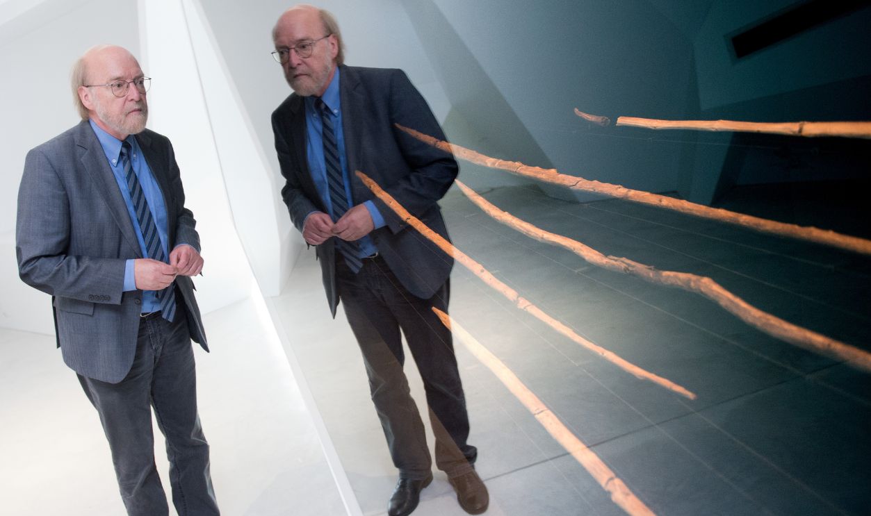The discoverer of the Schoeningen Spears, Hartmut Thieme, stands in front of the spears at the Exhibit and Research Centre Palaeon in Schoeningen, Germany, 24 June 2013. The 15 million euro project was officially opened on 24 June 2013. The oldest completely preserved hunting weapons in the world, the Schoeningen Spears, will be on display at the centre nineteen years after they were found in the open-cast lignite mine Schoeningen. 