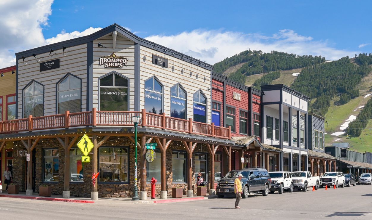 Jackson, Wyoming, USA - 27 May 2025: Panoramic view of the Broadway Shops in downtown Jackson. On the right is the town's sky slope for winter sports.
