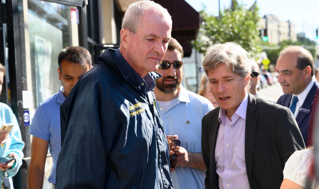 Millburn, New Jersey, USA - September 3, 2021: Governor Phil Murphy along with NJ representative Tom Malinowski talk with local store owners who sustained damage and loss after tropical storm IDA.