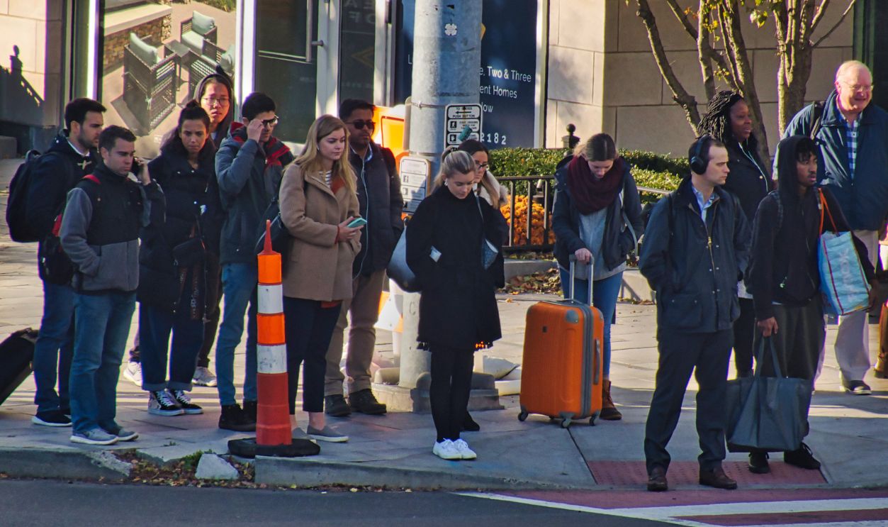 Stamford, Connecticut / USA - Circa November 2019:PedestrianCommuters at busy intersection in Stamford Ct. on a winter morning.