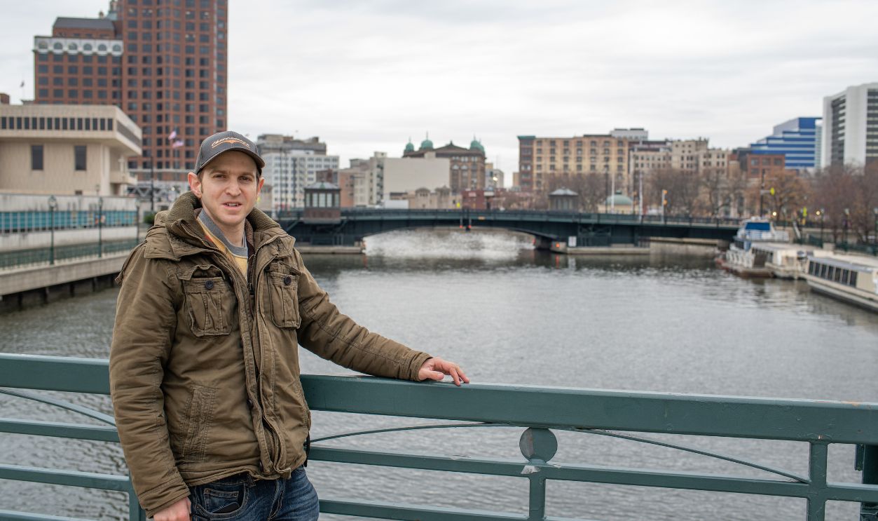 Milwaukee, WI: November 30, 2021: Tourist on a bridge in the city of Milwaukee. The population of Milwaukee is 577,222.