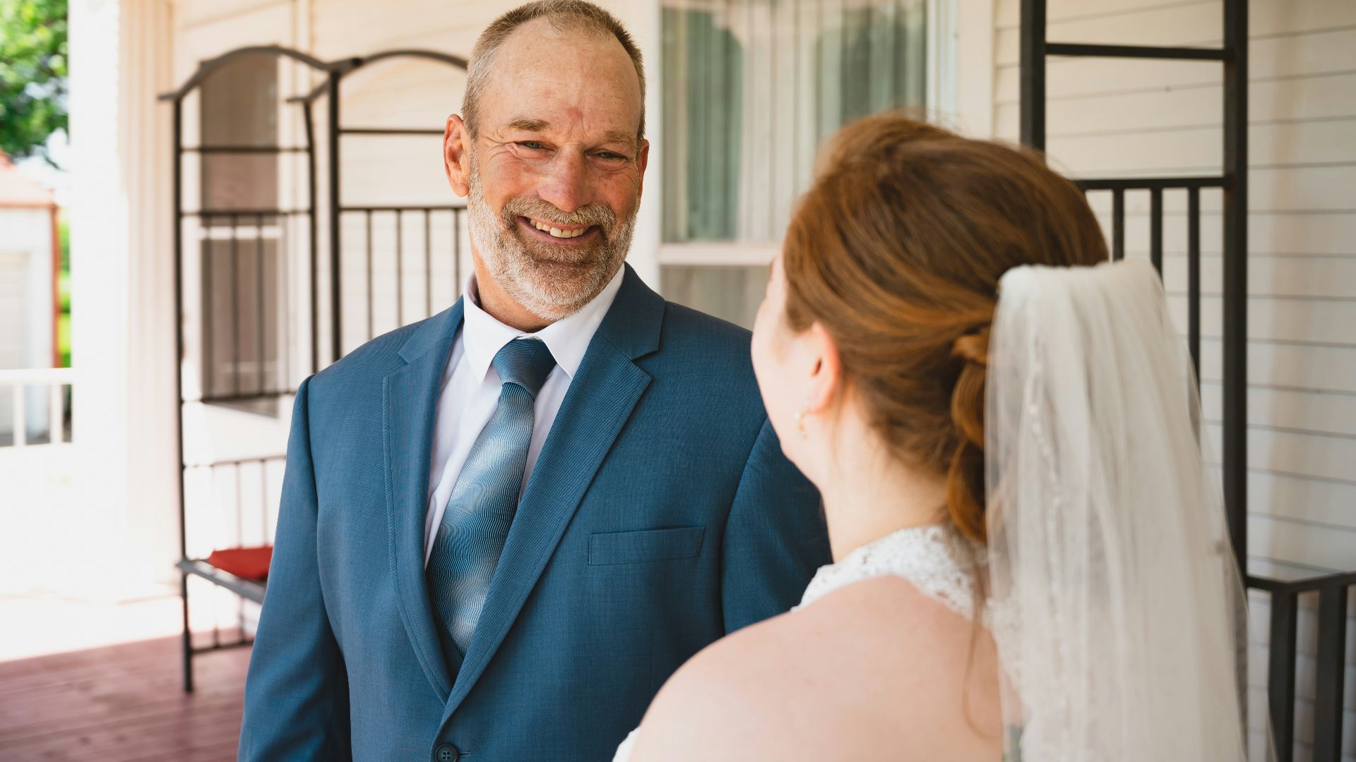 a man in a suit and tie standing next to a woman