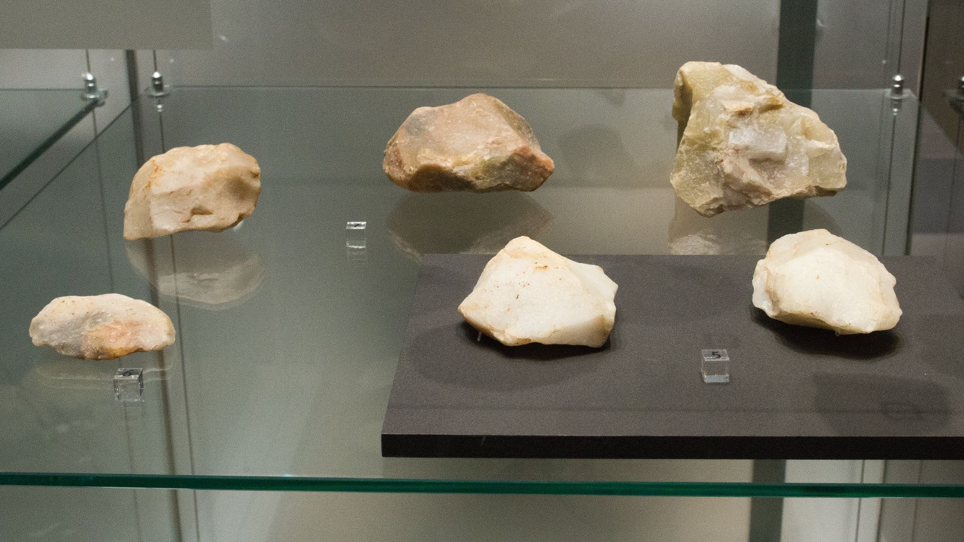 Middle Paleolithic tools from Stříbro (Tachov District), cca 250 000 – 40 000 BC. (5) Stone hand axes. Museum of Western Bohemia in Pilsen.