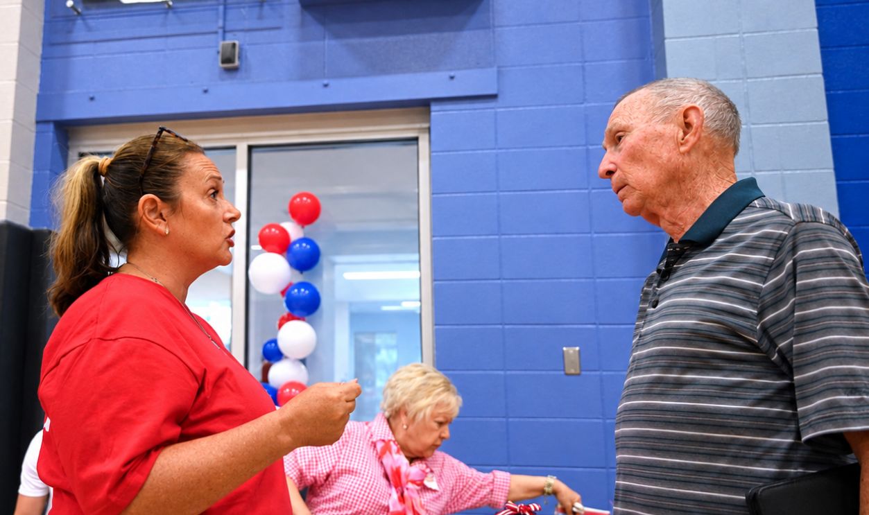 LENEXA KANSAS, USA - JUNE 6, 2026 Crnkovich (L) candidate for Johnson County Commission chair speaks with local member during the candidate campaign kickoff celebration 