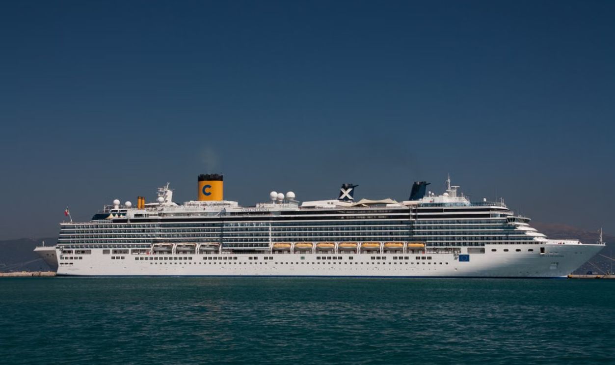 A majestic cruise ship sailing near Korfu, Greece under a clear blue sky
