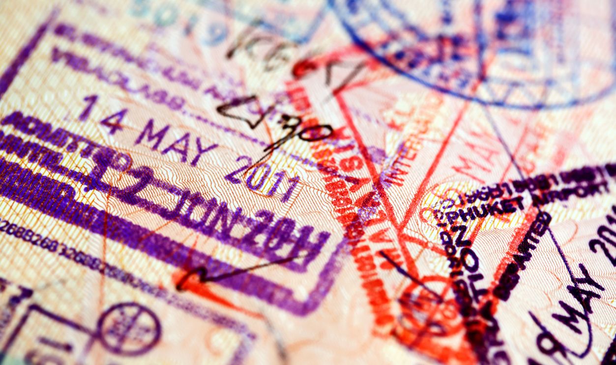 Various immigration control stamps inside passport