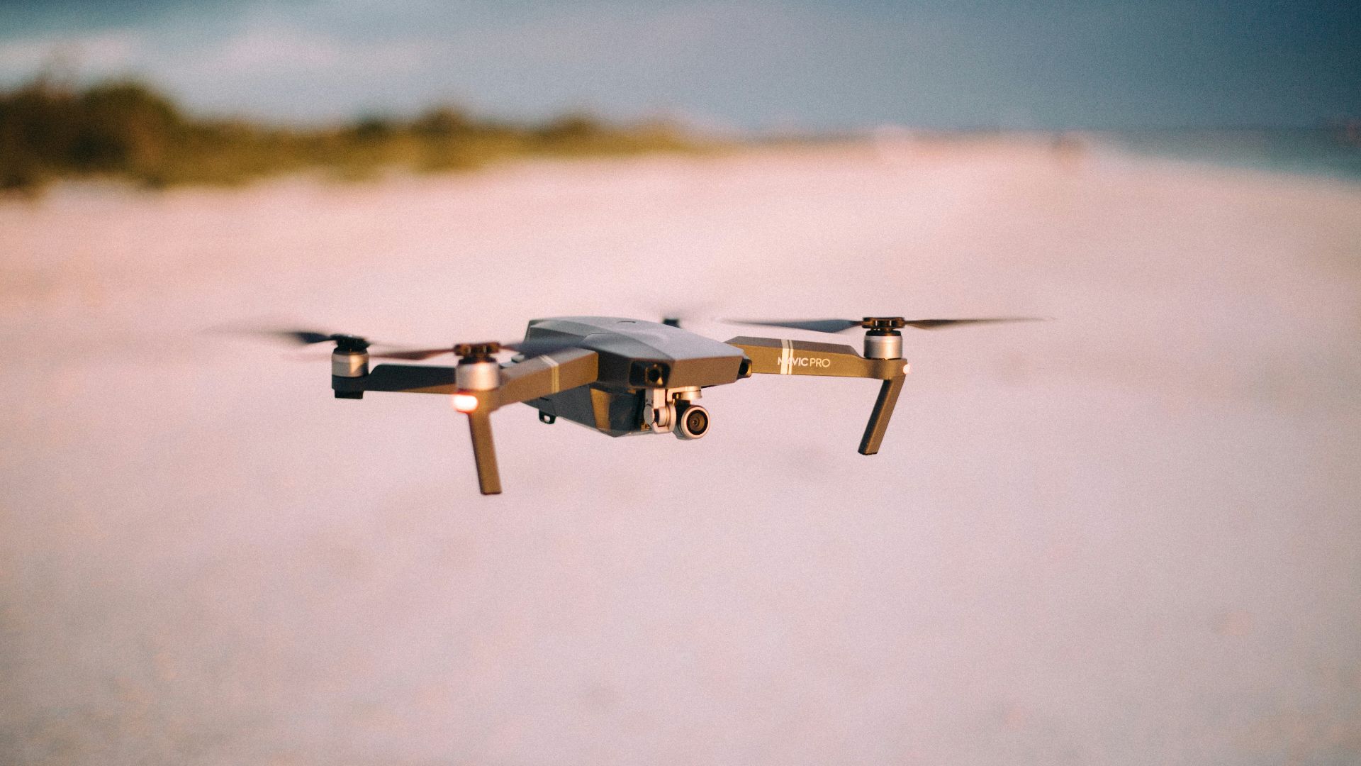 shallow focus photography of flying quadcopter