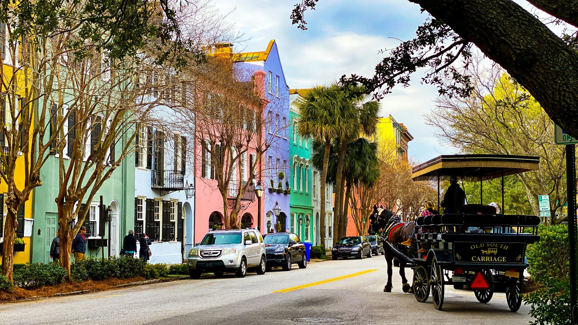 people riding on carriage on road during daytime