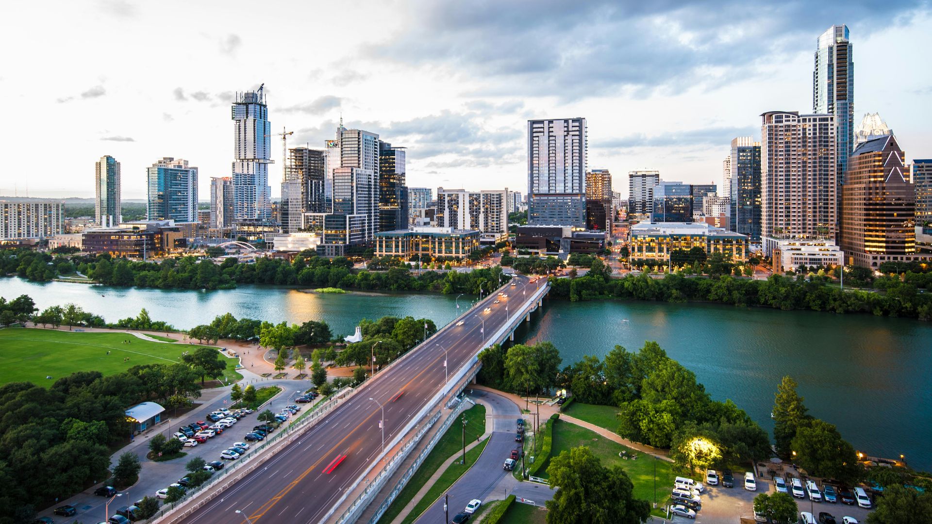 An aerial view of the Austin skyline and Congress Avenue Bridge over Lady Bird Lake