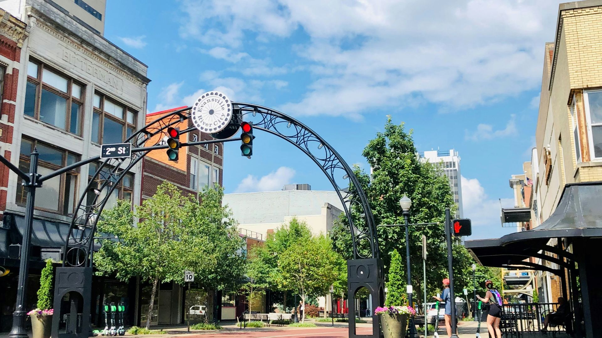 a street with a clock on the top of it